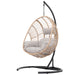 Outdoor Indoor Swing Egg Chair Natural color wicker with beige cushion image